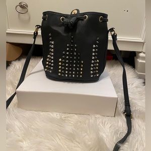 Studded cross body with adjustable strap